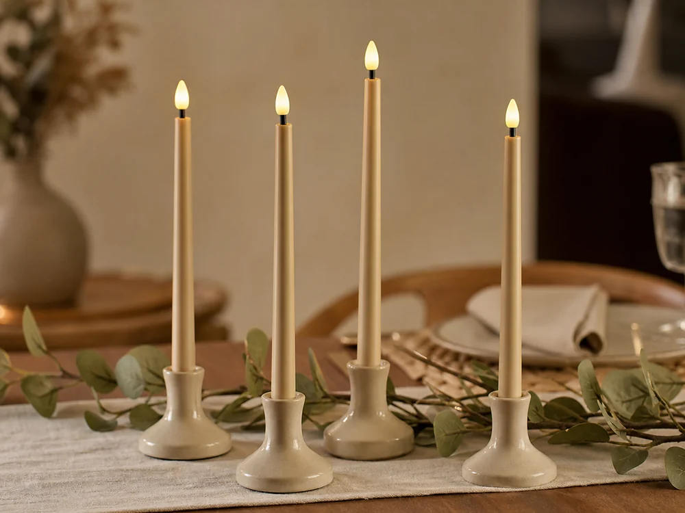 beige electric candlesticks with plastic LED flame tips on a neutral dining table