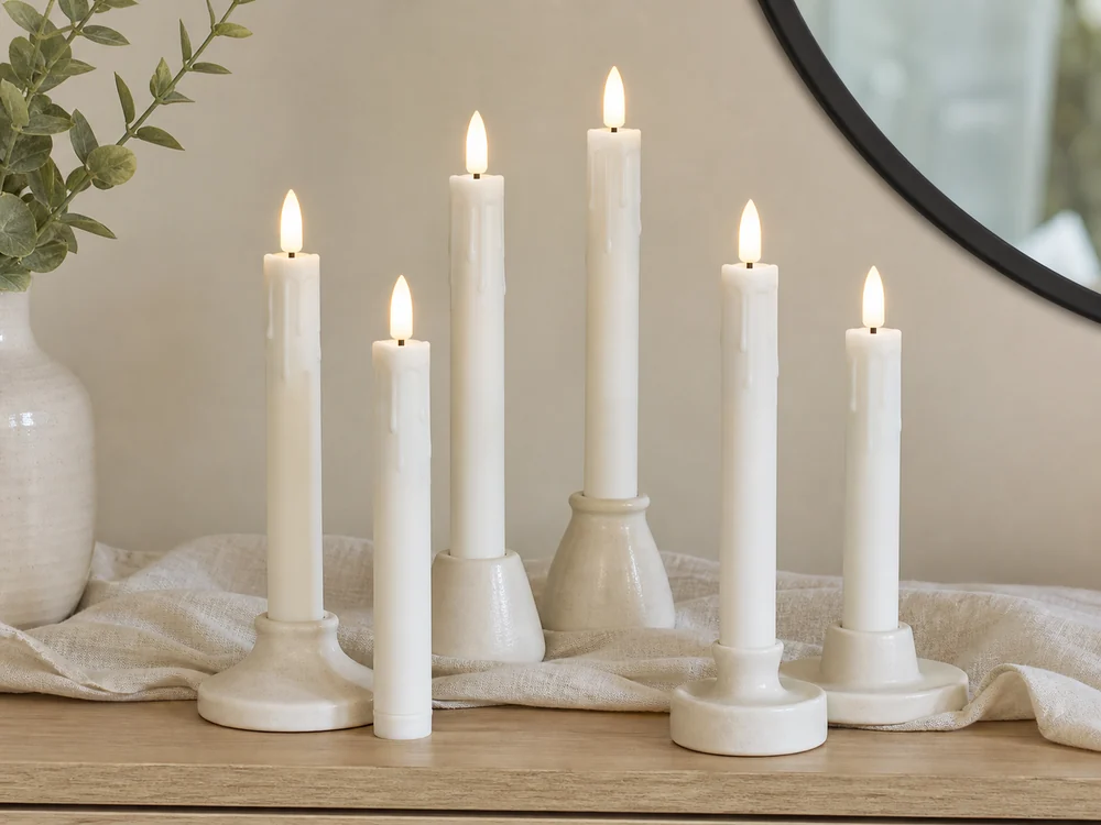 white flameless taper candles with molded wax drip texture and plastic LED flame tips